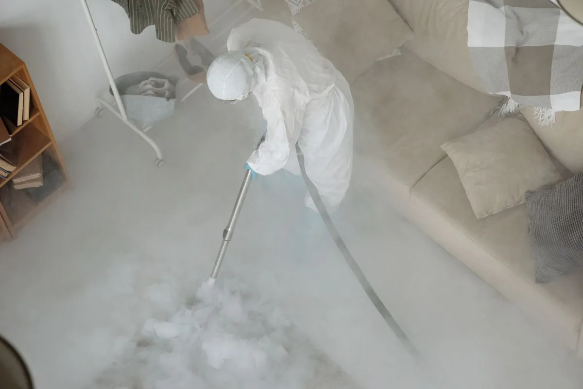 Biohazard cleanup technician in protective equipment, Forestdale, MA